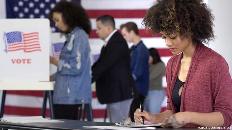 Woman at a voting booth